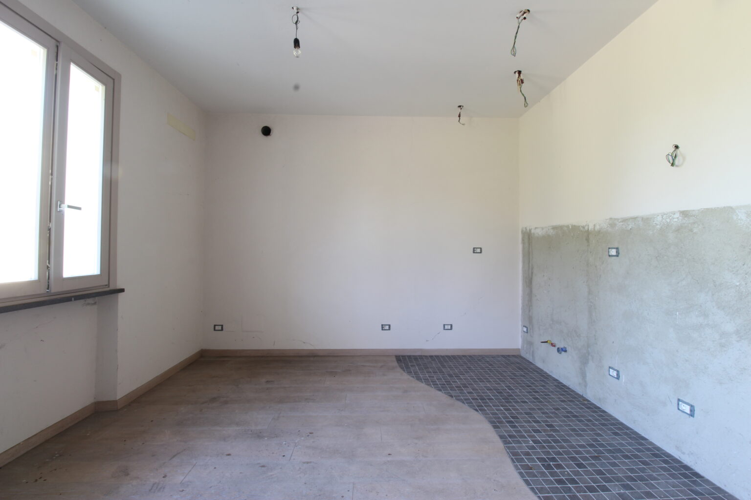 soggiorno con angolo cottura