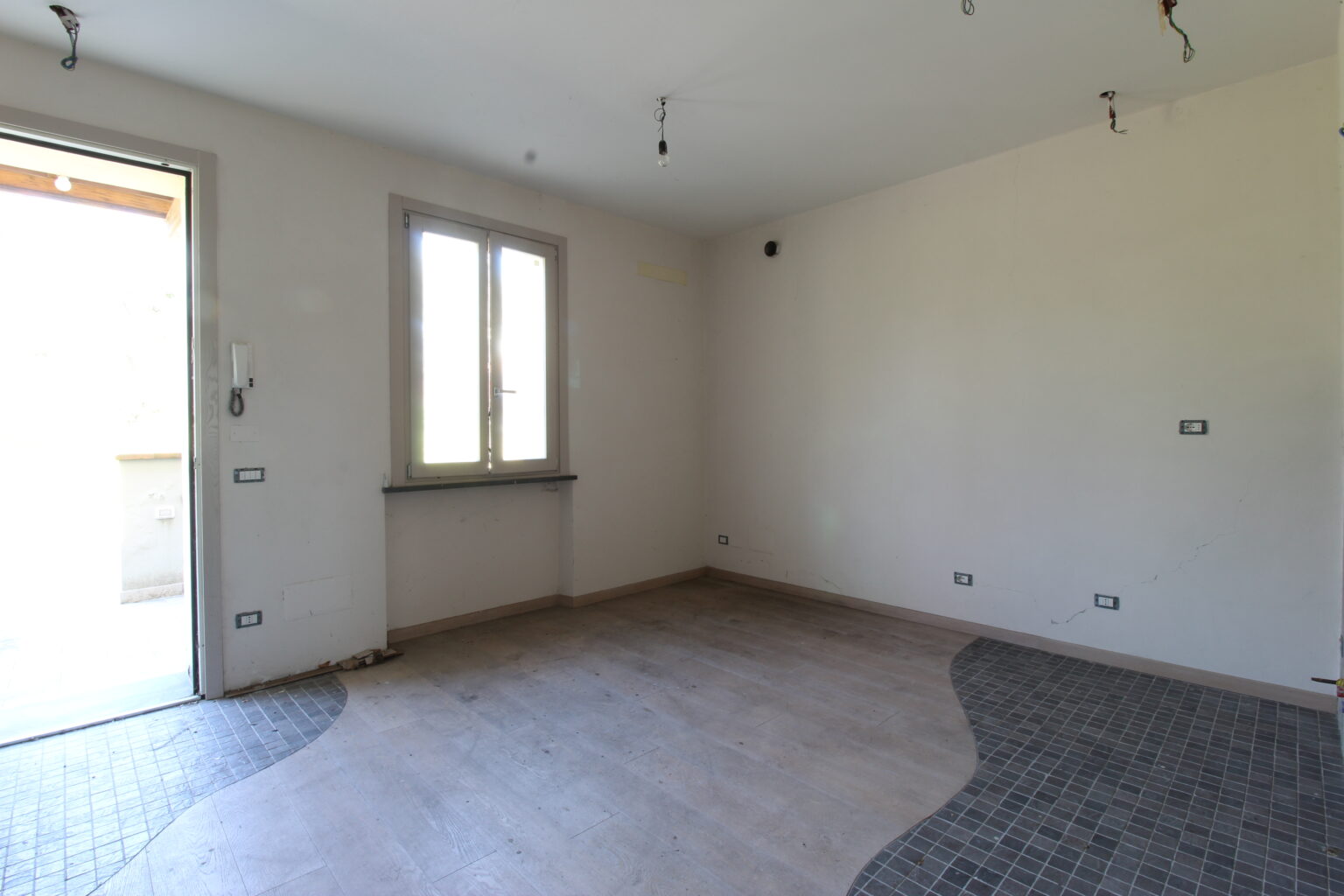 soggiorno con angolo cottura