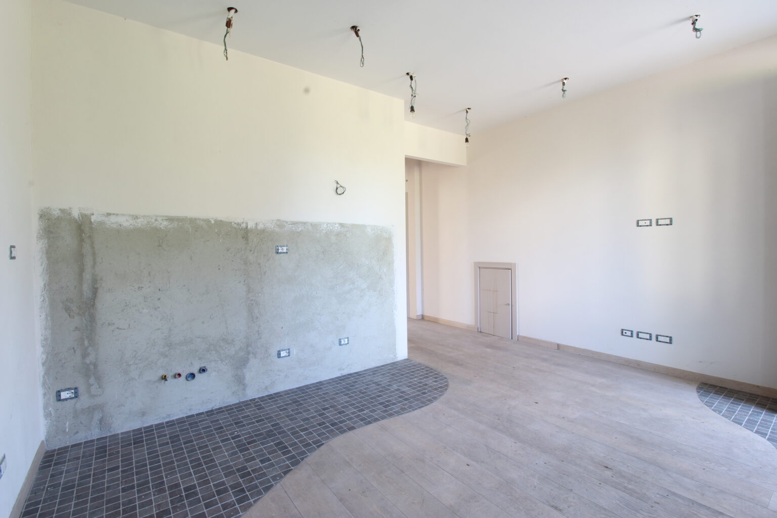 soggiorno con angolo cottura